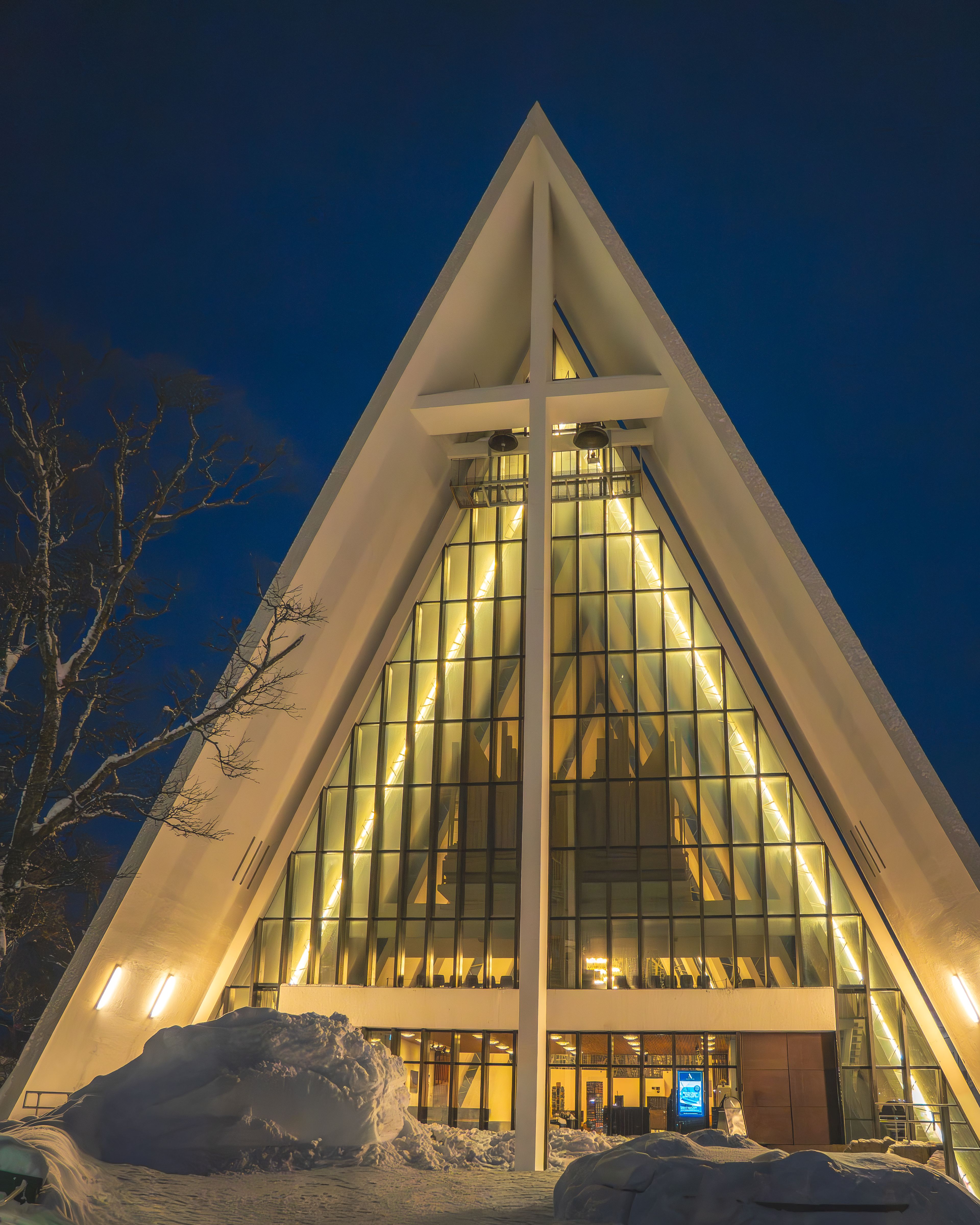 Arctic Cathedral illuminated against a deep blue sky