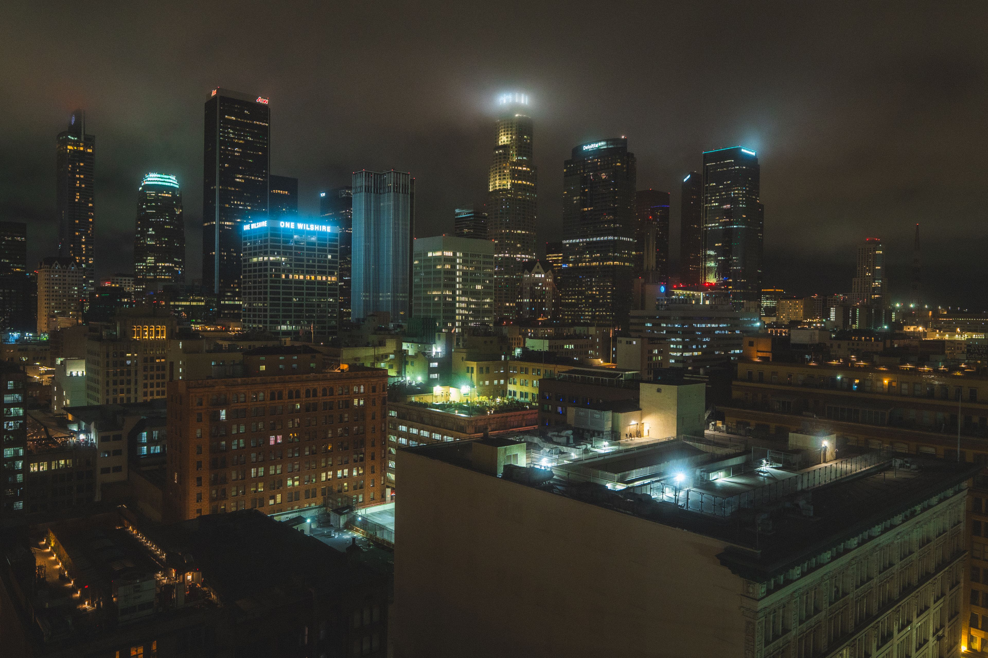 Downtown LA skyline glowing through fog at night